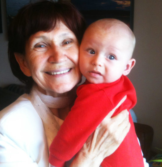 Grandmother holding grandson in her arms